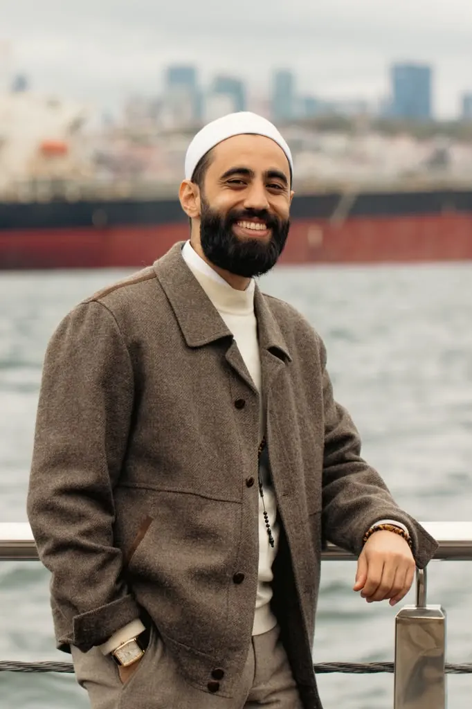 Dr. Ahmad Deeb smiling by the water